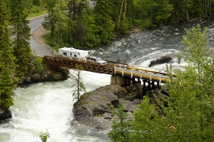 Truck and trailer crossing a river